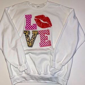 Women’s Valentine’s Day Sweatshirt.  Unisex Large.  White with “LOVE” patterns.